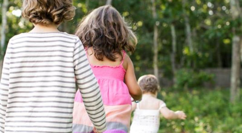 rear-view-of-female-toddler-followed-by-boy-and-girl